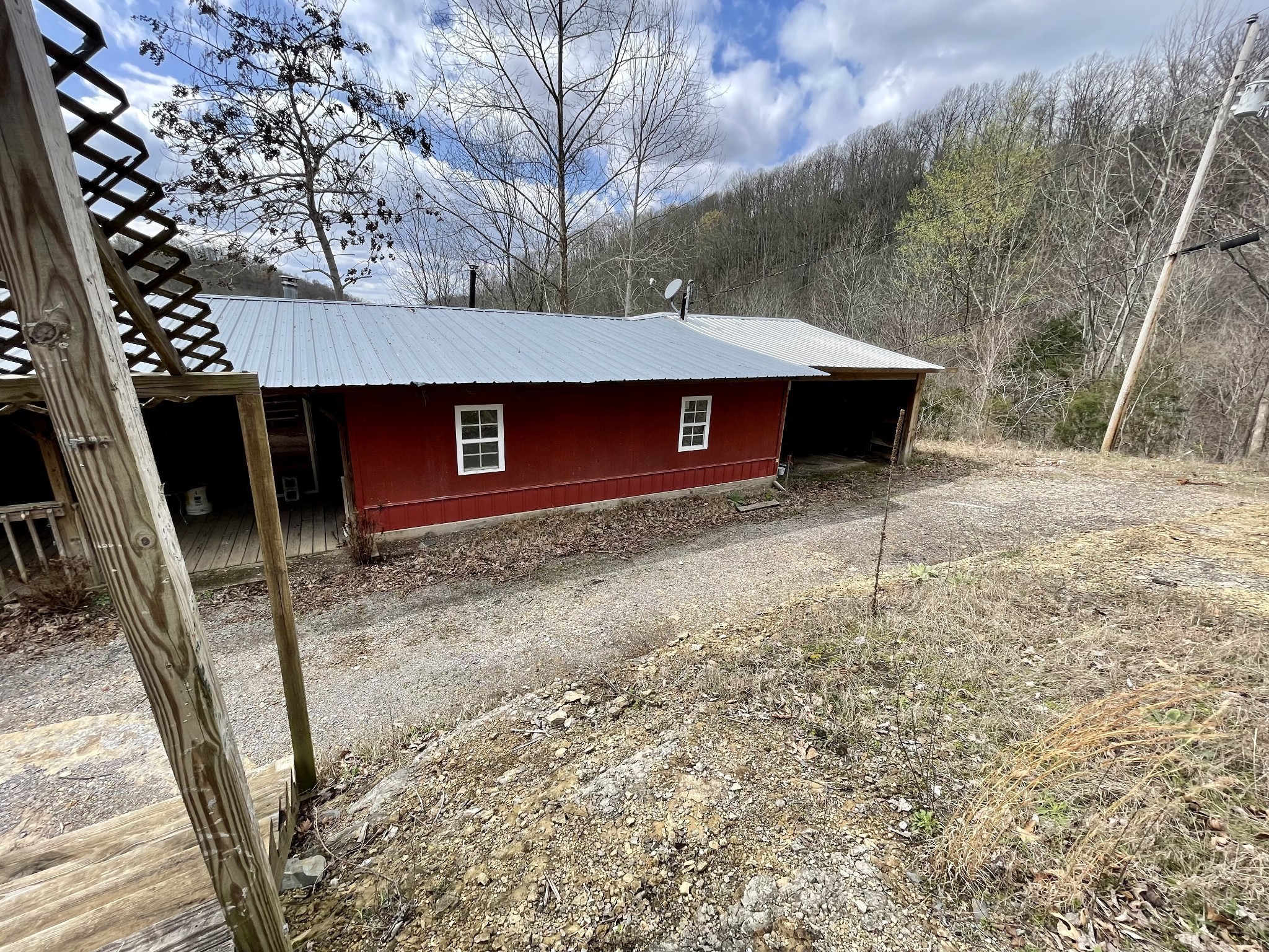 250 Possum Hollow Road Dowelltown, TN 37059 - Photo 3 of 31 a view of a road with wooden fence