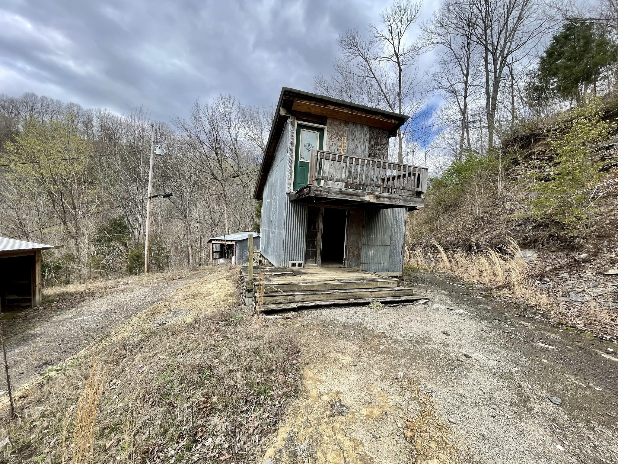 250 Possum Hollow Road Dowelltown, TN 37059 - Photo 10 of 31 a view of house with yard and trees in the background