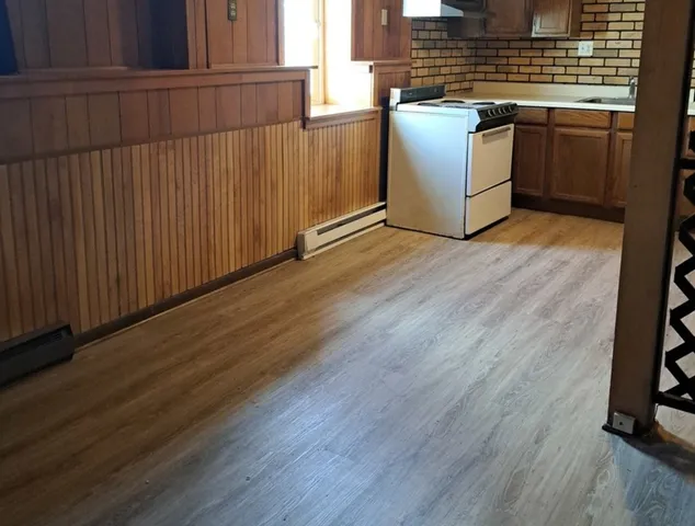 a view of kitchen with wooden floor