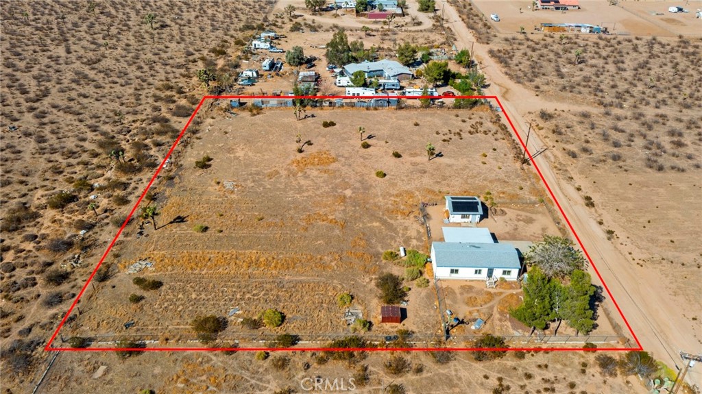 11772-11772 Middleton Road Phelan, CA 92371 - Photo 1 of 40 an aerial view of beach and multi story building