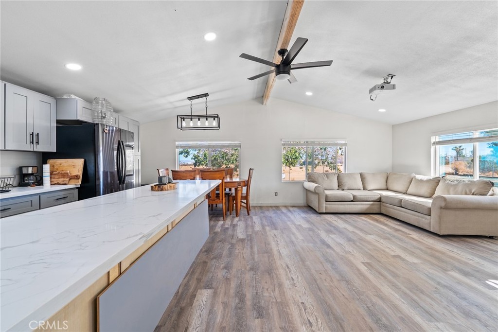 11772-11772 Middleton Road Phelan, CA 92371 - Photo 12 of 40 a living room with furniture and kitchen view
