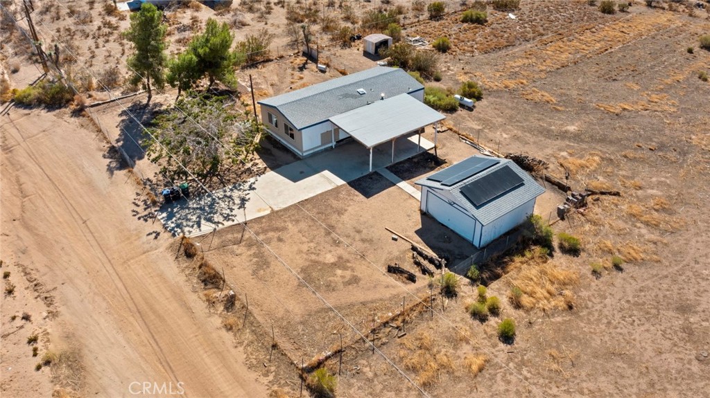 11772-11772 Middleton Road Phelan, CA 92371 - Photo 27 of 40 an aerial view of a house with a yard and trees