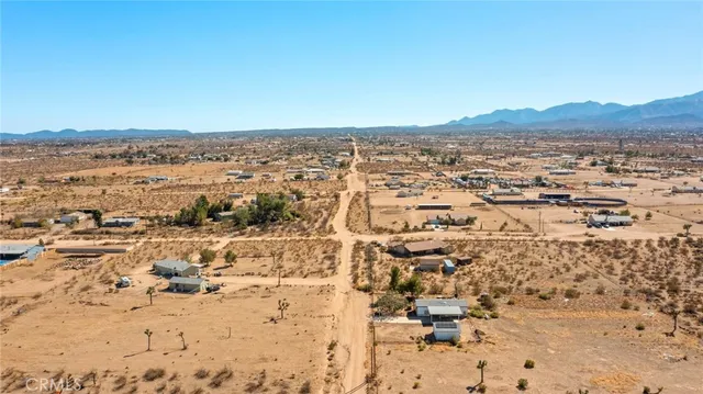 an aerial view of house with yard