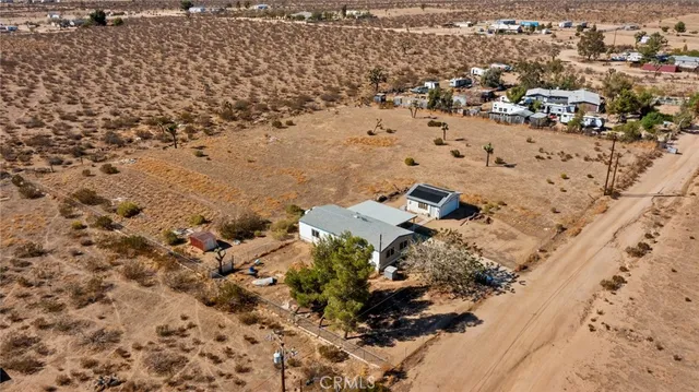 an aerial view of house with beach