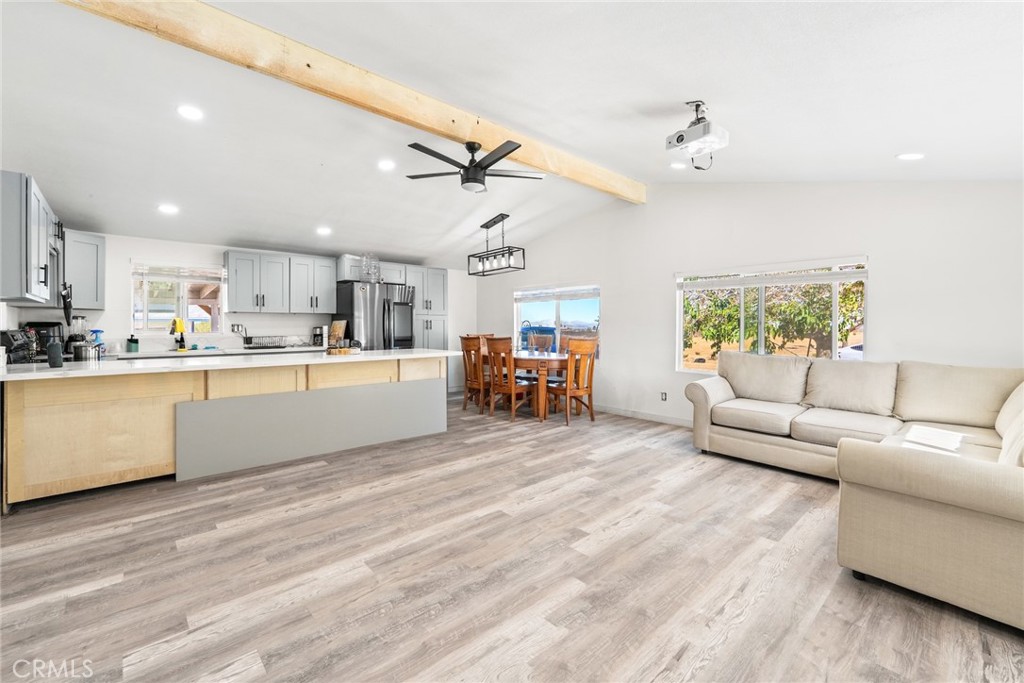 11772-11772 Middleton Road Phelan, CA 92371 - Photo 7 of 40 a living room with furniture and kitchen view