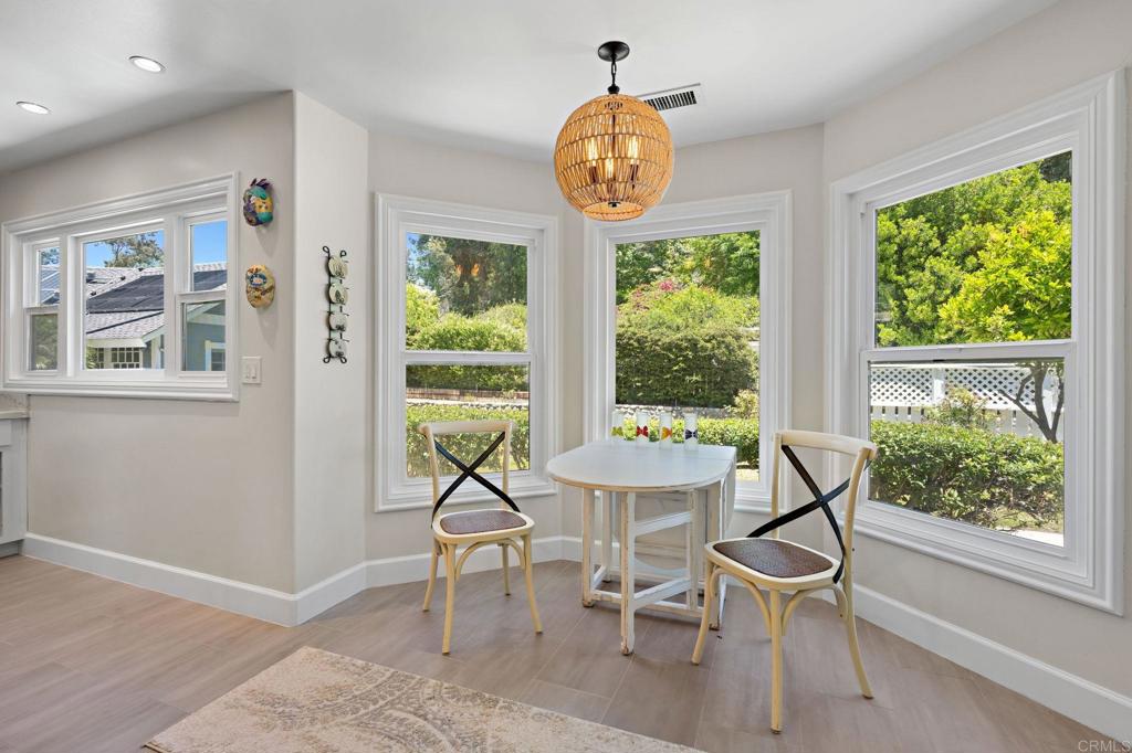 18 Gateview Drive Fallbrook, CA 92028 - Photo 12 of 73 a view of a dining room with furniture a chandelier and wooden floor