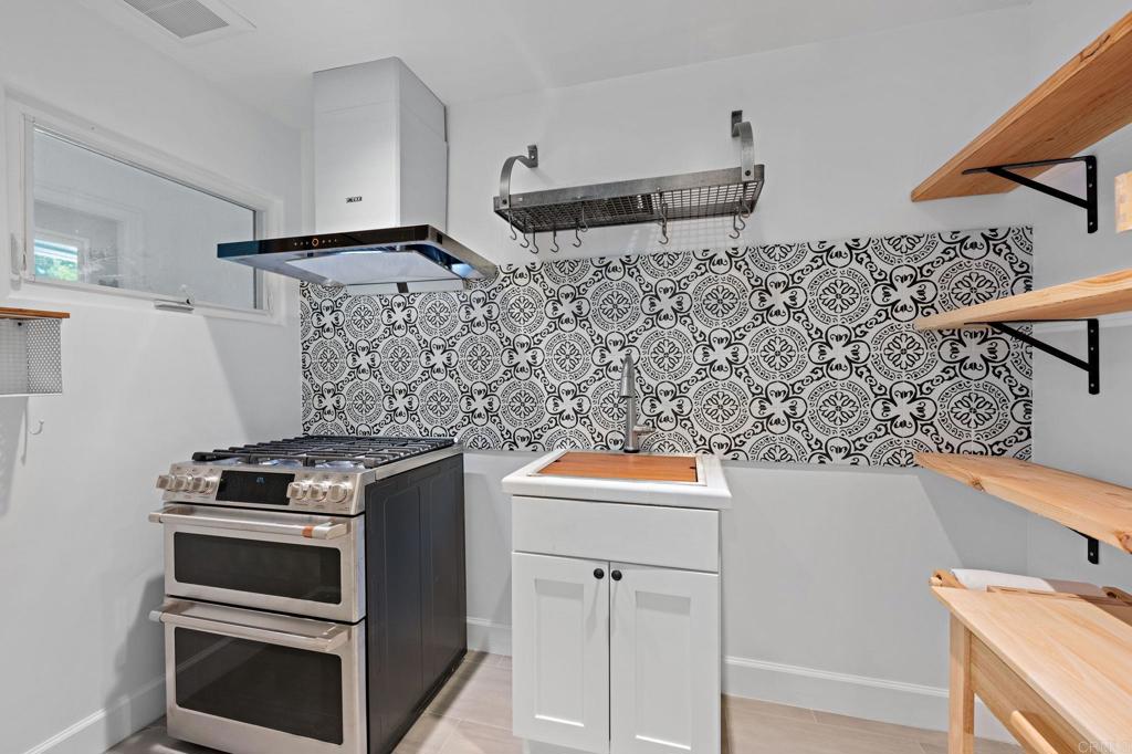 18 Gateview Drive Fallbrook, CA 92028 - Photo 13 of 73 a kitchen with stainless steel appliances wooden floor and a sink