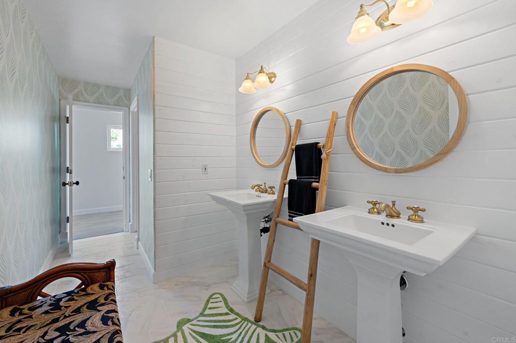18 Gateview Drive Fallbrook, CA 92028 - Photo 19 of 73 a bathroom with a sink a light fixture and a mirror