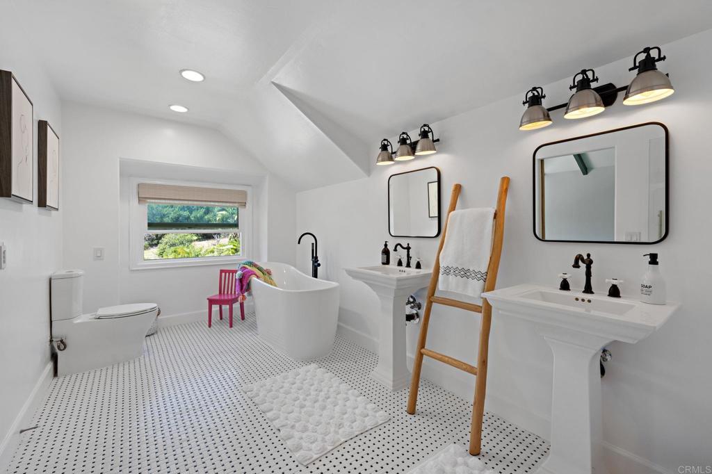 18 Gateview Drive Fallbrook, CA 92028 - Photo 35 of 73 a bathroom with a sink mirror and toilet