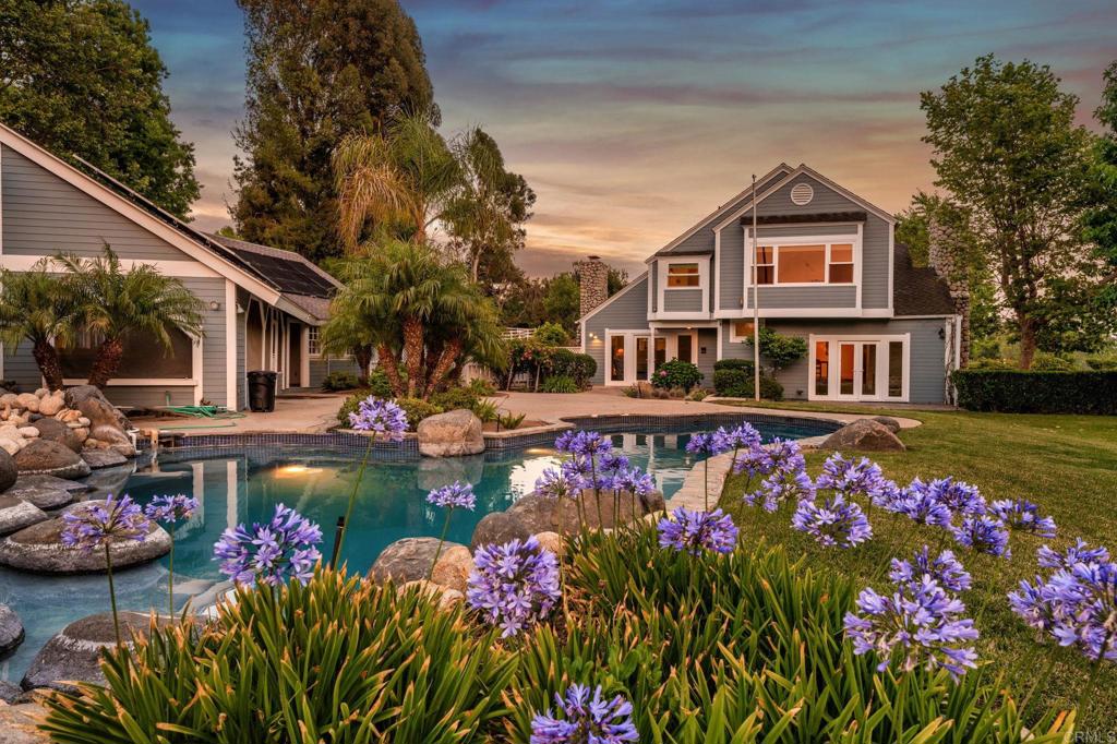 18 Gateview Drive Fallbrook, CA 92028 - Photo 41 of 73 a front view of a house with lots of flowers and trees