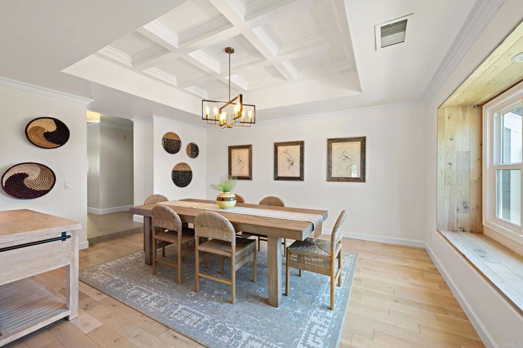 18 Gateview Drive Fallbrook, CA 92028 - Photo 5 of 73 a view of a dining room and livingroom with furniture wooden floor and a rug