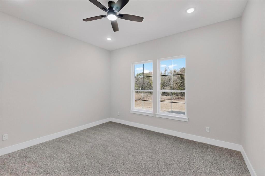 1161 Gonzollas Road Springtown, TX 76082 - Photo 20 of 40 an empty room with a window
