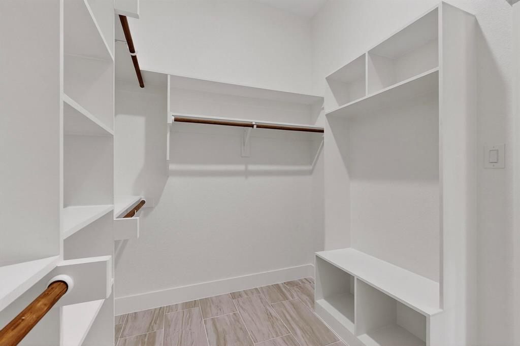 1161 Gonzollas Road Springtown, TX 76082 - Photo 22 of 40 a view of walk in closet with empty racks