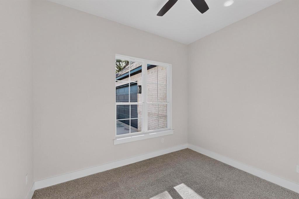 1161 Gonzollas Road Springtown, TX 76082 - Photo 33 of 40 an empty room with windows and fan