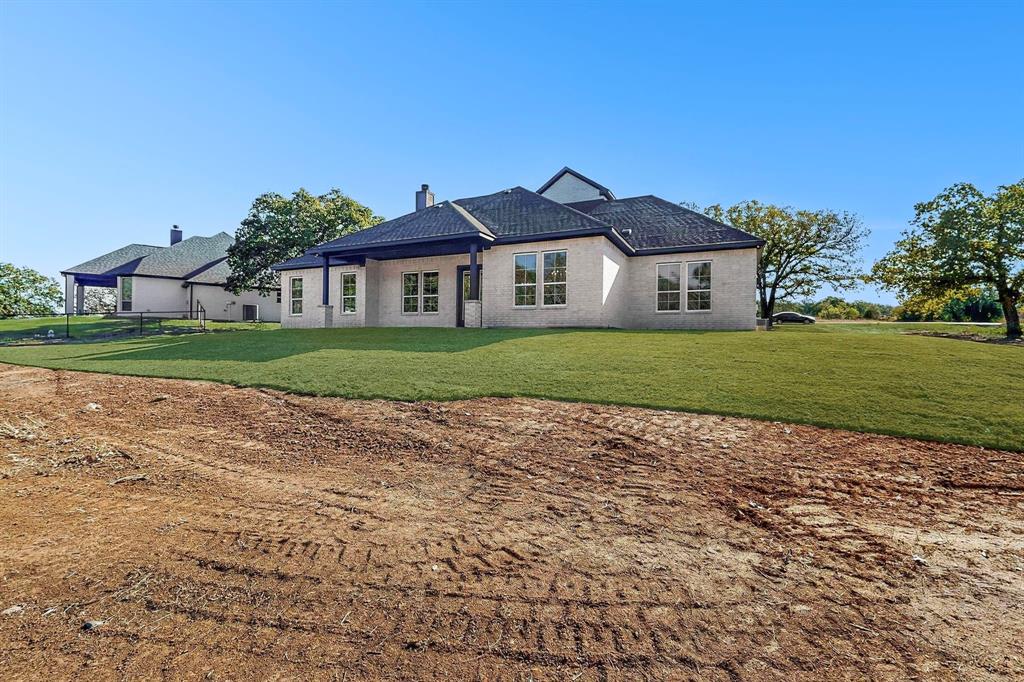 1161 Gonzollas Road Springtown, TX 76082 - Photo 39 of 40 a front view of a house with a yard