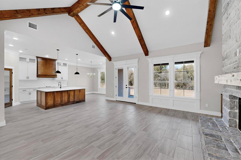 1161 Gonzollas Road Springtown, TX 76082 - Photo 9 of 40 a view of kitchen with furniture and wooden floor