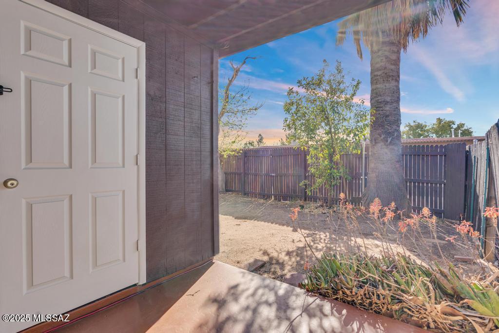 211 West Roger Road, Unit 35 Tucson, AZ 85705 - Photo 21 of 24 a view of a backyard with wooden fence