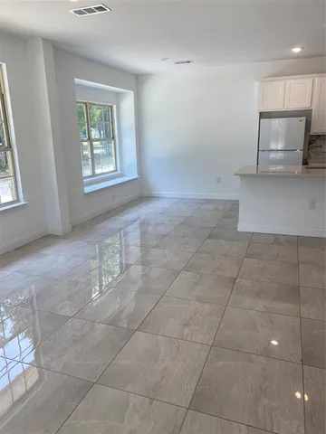 a view of a kitchen with furniture and a window