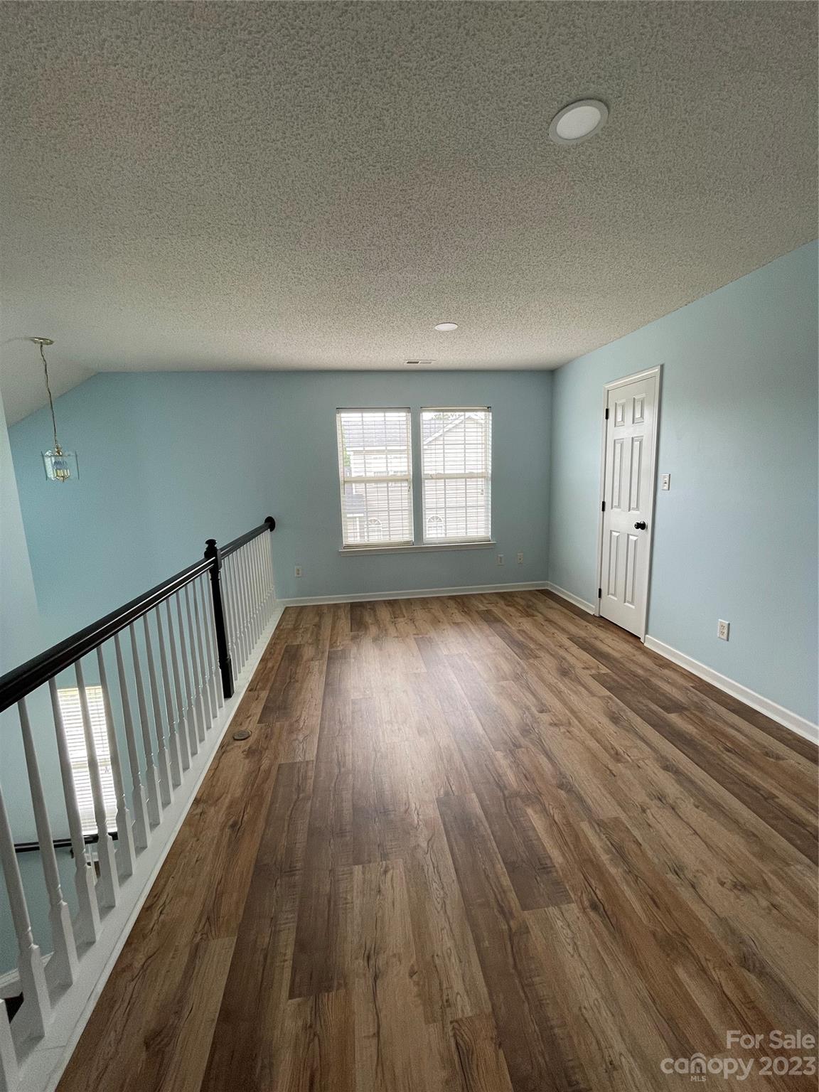 4045 Suttle Place Matthews, NC 28104 - Photo 20 of 42 wooden floor in an empty room with a window