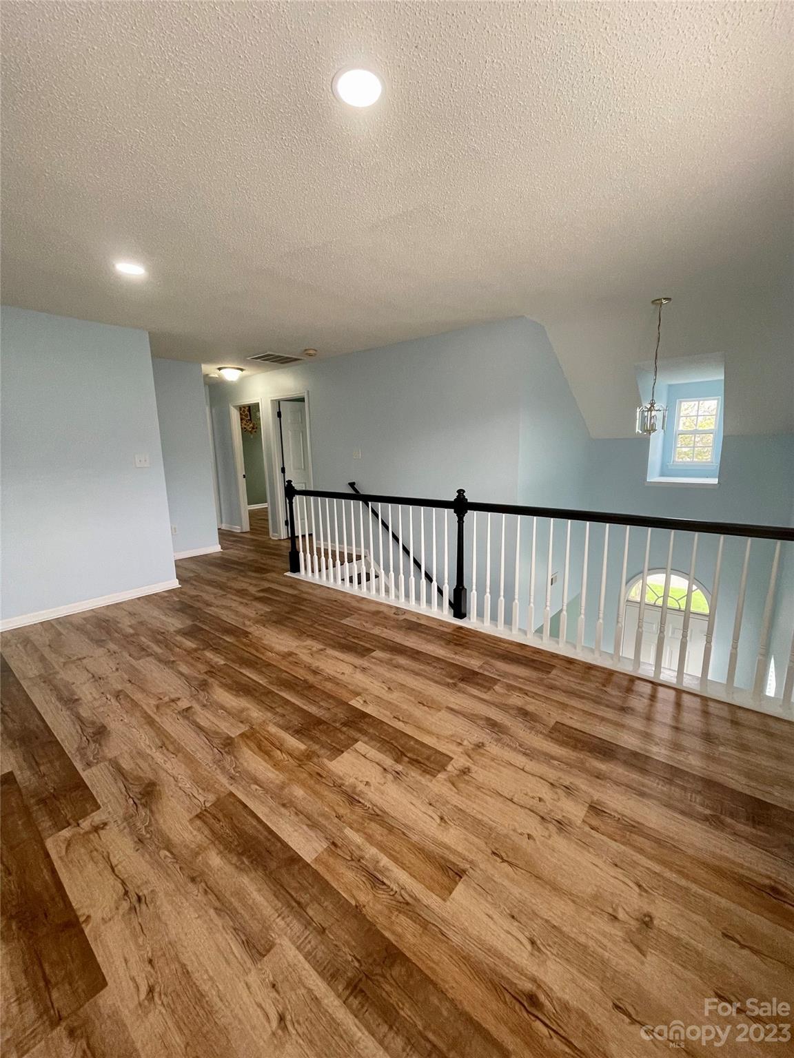 4045 Suttle Place Matthews, NC 28104 - Photo 22 of 42 a view of hallway with wooden floor