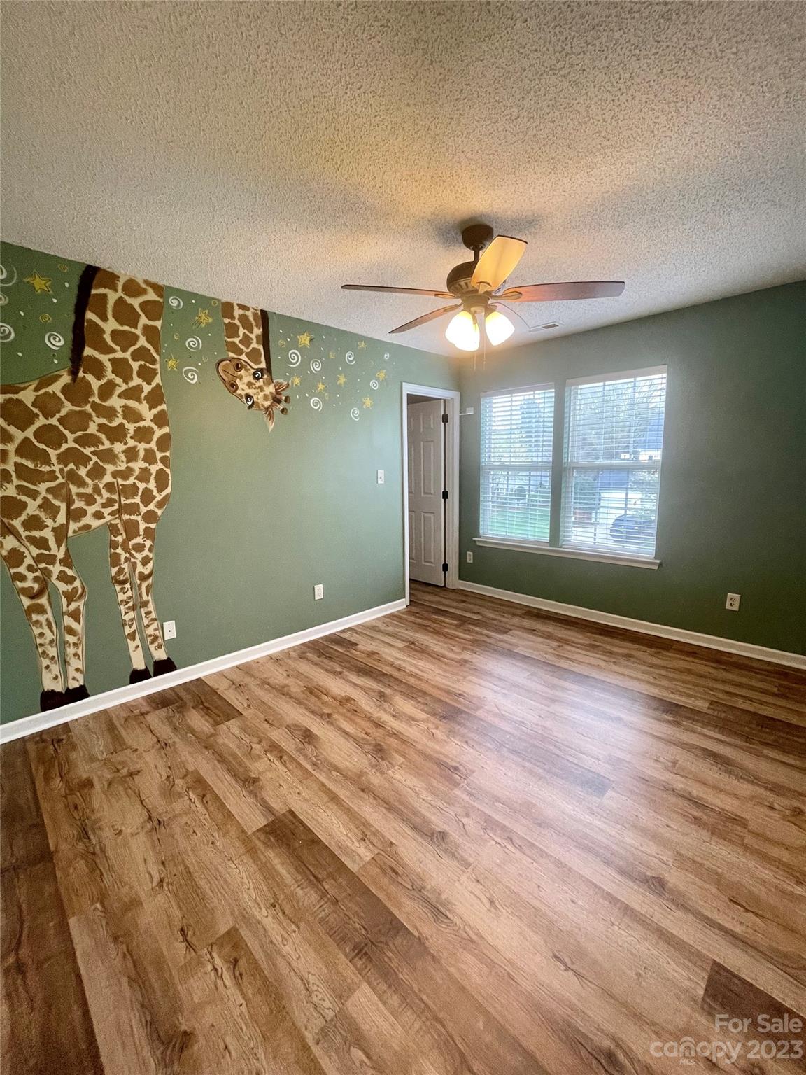4045 Suttle Place Matthews, NC 28104 - Photo 26 of 42 a view of empty room with window and ceiling fan