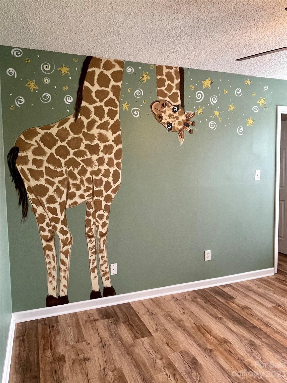 4045 Suttle Place Matthews, NC 28104 - Photo 27 of 42 a view of a chandelier fan and wooden floor