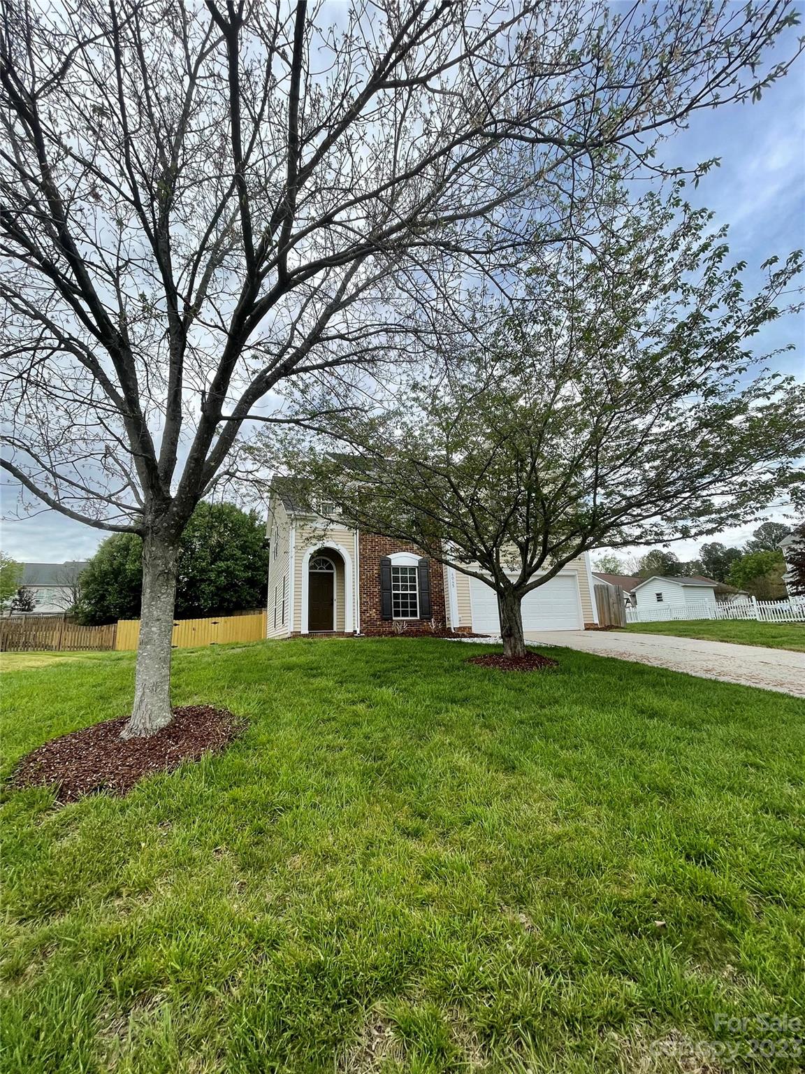 4045 Suttle Place Matthews, NC 28104 - Photo 3 of 42 a view of a yard in front of the house