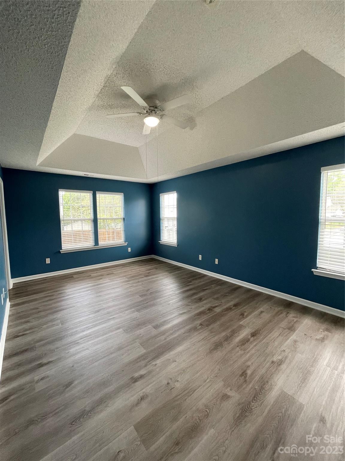 4045 Suttle Place Matthews, NC 28104 - Photo 32 of 42 an empty room with wooden floor and windows