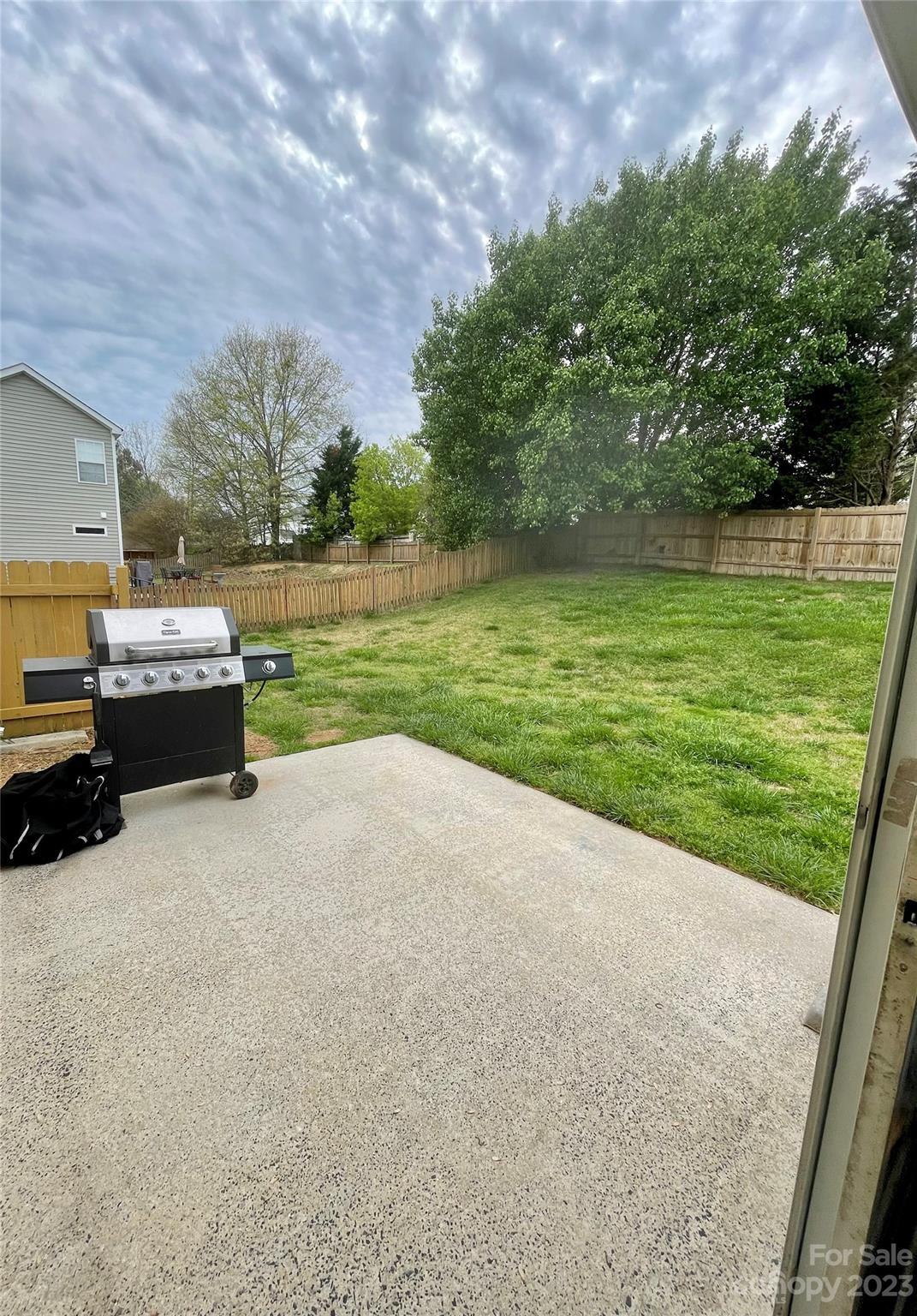 4045 Suttle Place Matthews, NC 28104 - Photo 36 of 42 a view of a house with a yard and a car park