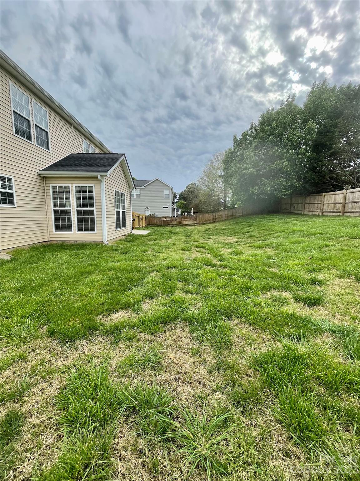 4045 Suttle Place Matthews, NC 28104 - Photo 41 of 42 a front view of a house with a yard