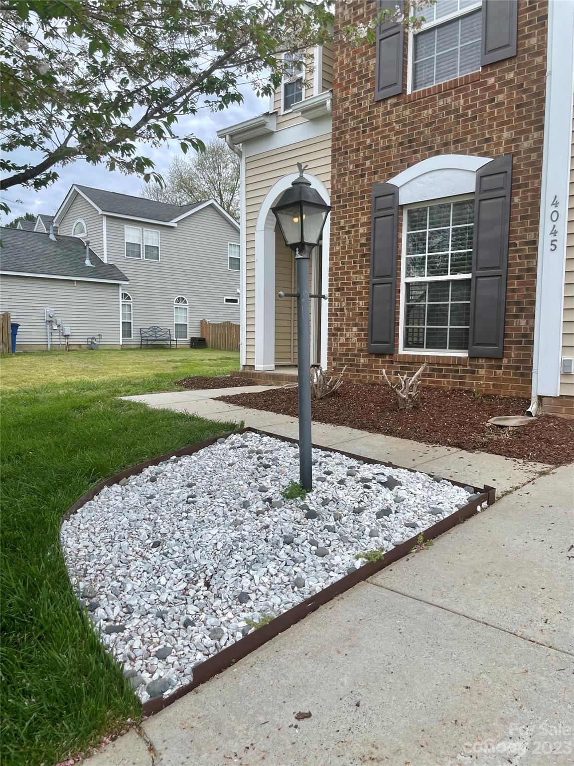 4045 Suttle Place Matthews, NC 28104 - Photo 6 of 42 a front view of a house with garden