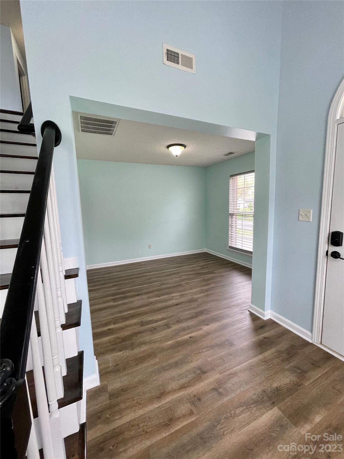 4045 Suttle Place Matthews, NC 28104 - Photo 9 of 42 an empty room with wooden floor and windows
