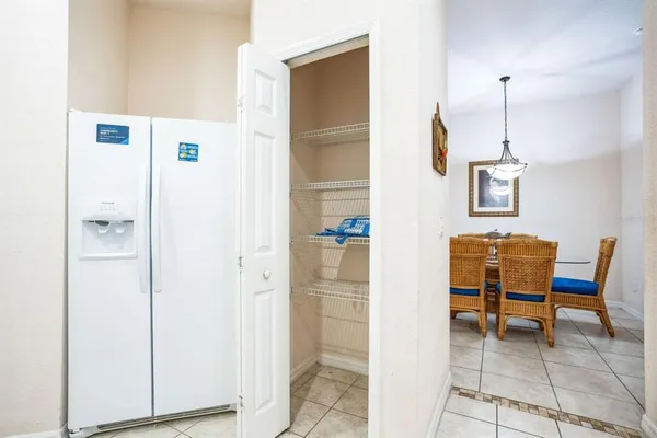 a hallway with a door and a mirror