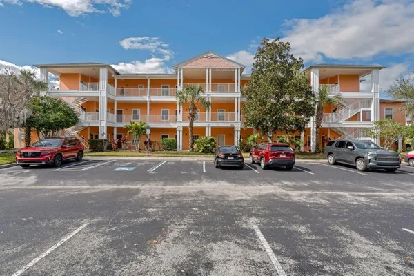 a view of a cars parked in front of a building