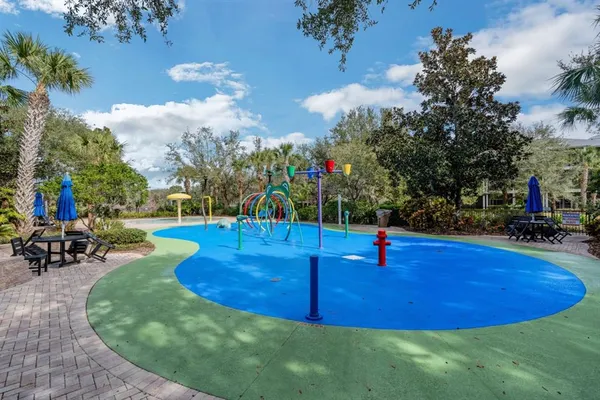 a swimming pool with outdoor seating and yard