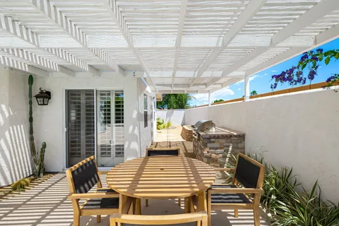 an aerial view of a house with a swimming pool