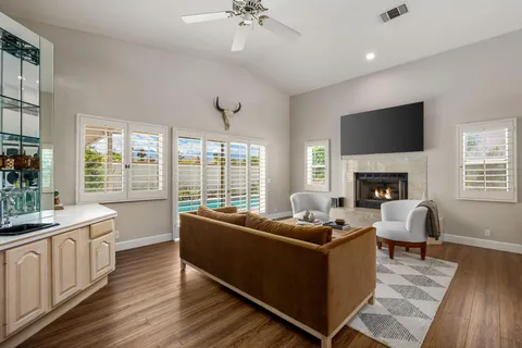 a living room with furniture fireplace and a flat screen tv