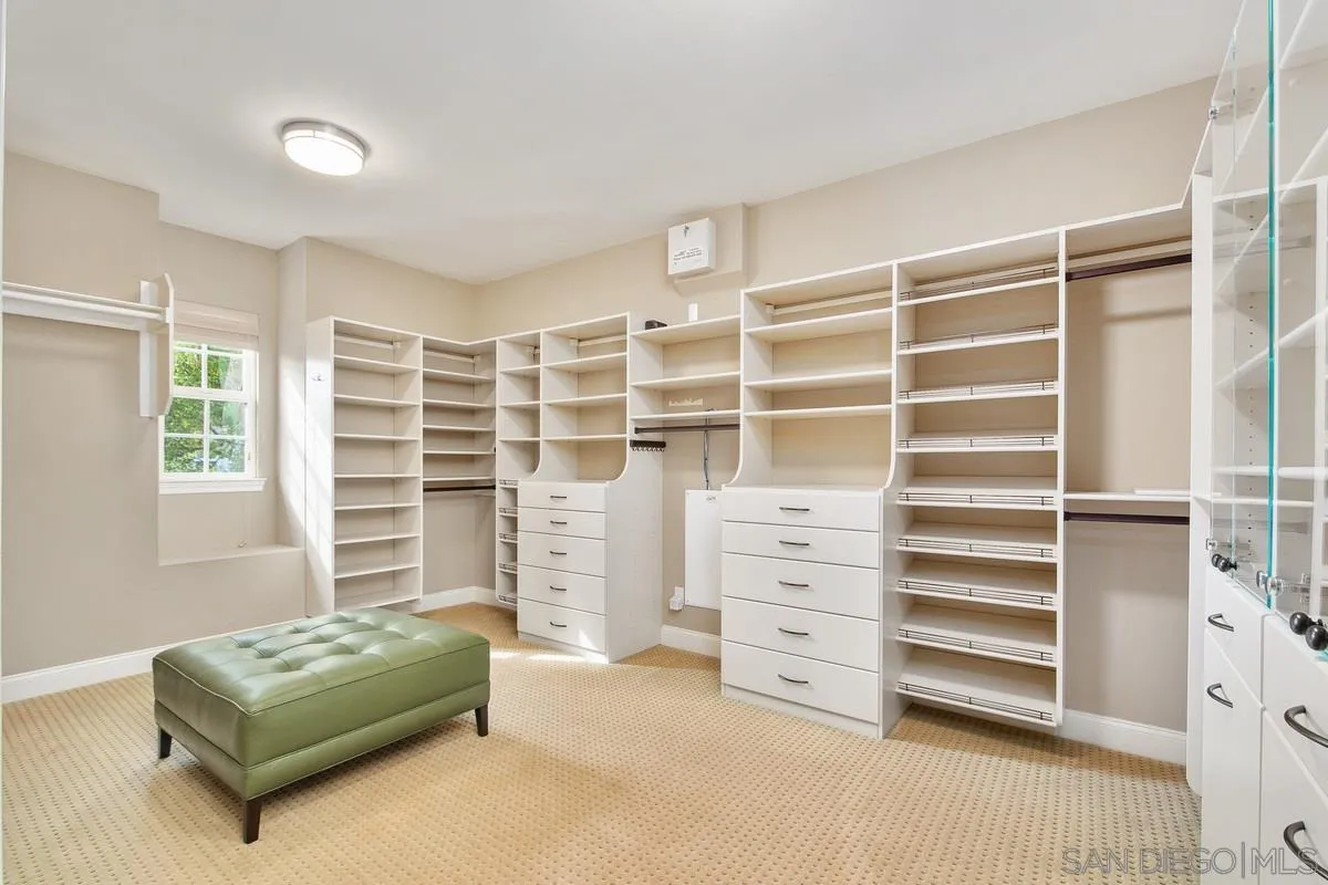 6941 Sitio Cordero Carlsbad, CA 92009 - Photo 19 of 44 a living room with furniture and a window