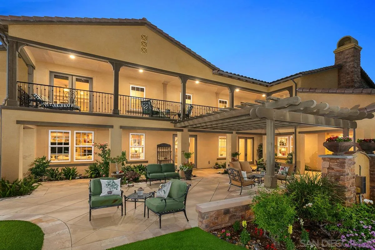 6941 Sitio Cordero Carlsbad, CA 92009 - Photo 2 of 44 a view of a patio with couches table and chairs and potted plants