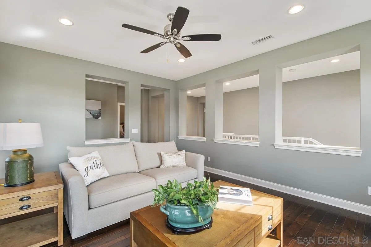 6941 Sitio Cordero Carlsbad, CA 92009 - Photo 21 of 44 a living room with furniture and a potted plant