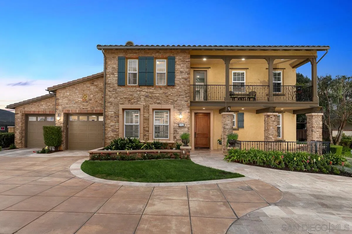 6941 Sitio Cordero Carlsbad, CA 92009 - Photo 31 of 44 a front view of a house with a yard