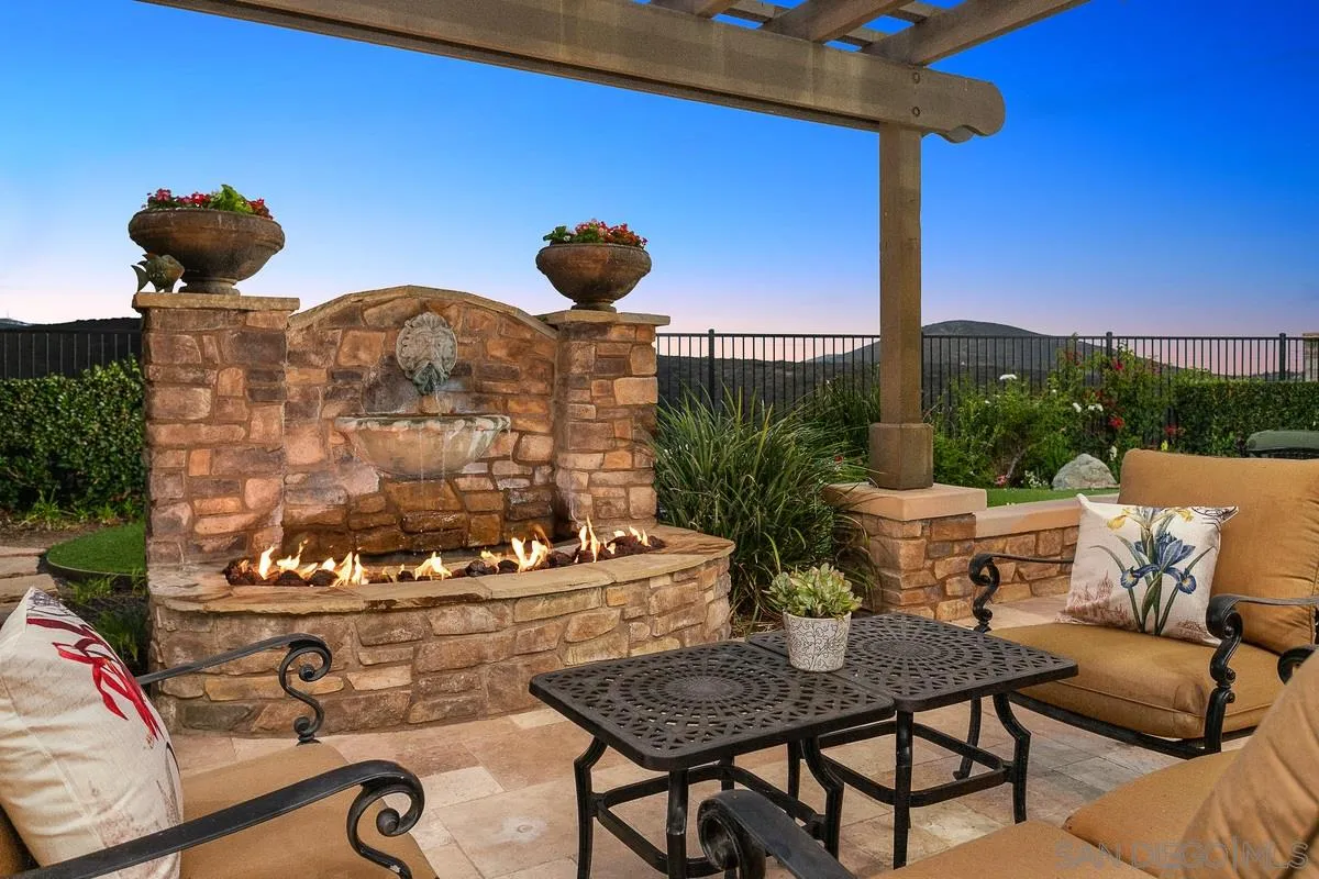 6941 Sitio Cordero Carlsbad, CA 92009 - Photo 32 of 44 a view of a chairs and table in patio