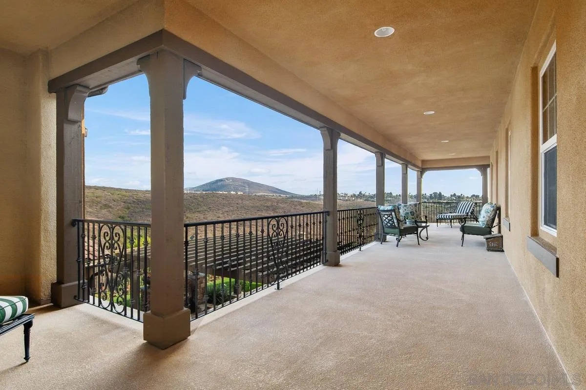6941 Sitio Cordero Carlsbad, CA 92009 - Photo 35 of 44 a view of a terrace with chairs and floor to ceiling window