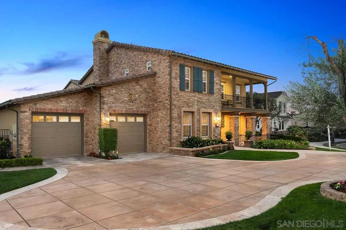 6941 Sitio Cordero Carlsbad, CA 92009 - Photo 39 of 44 a front view of a house with a yard and trees