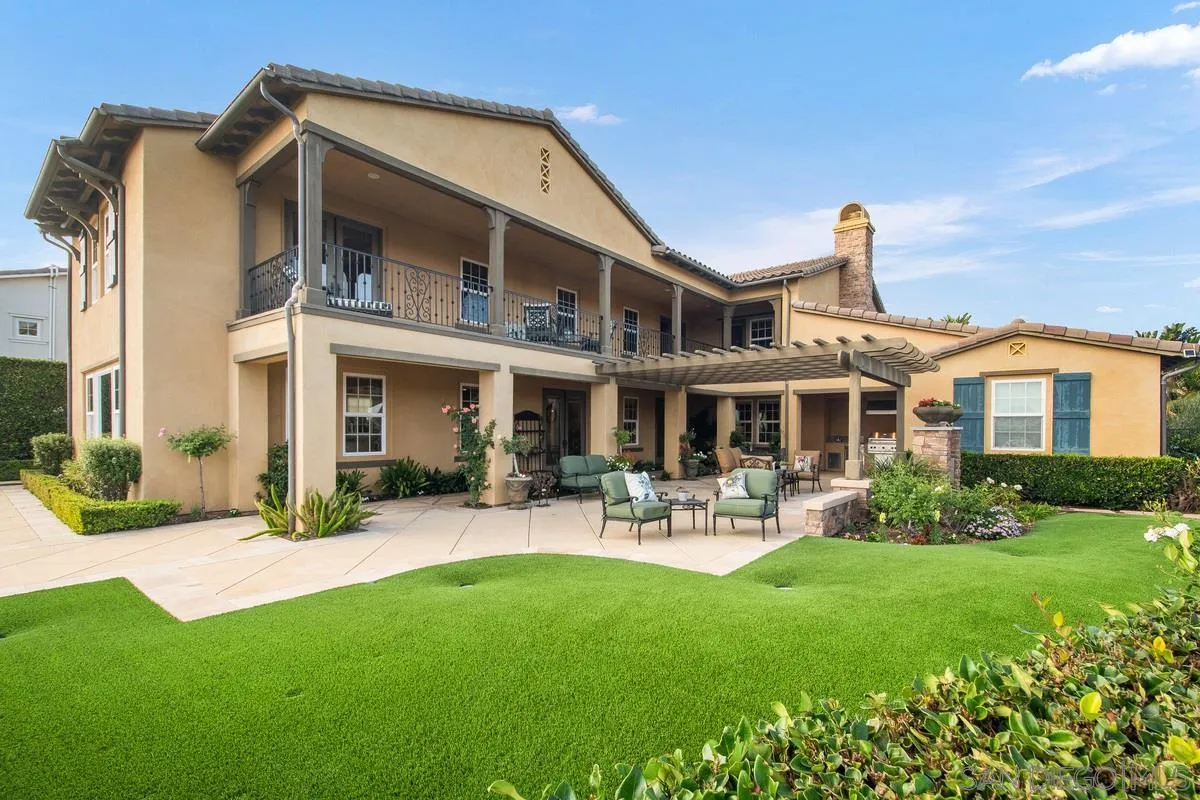 6941 Sitio Cordero Carlsbad, CA 92009 - Photo 42 of 44 a front view of a house with garden and porch