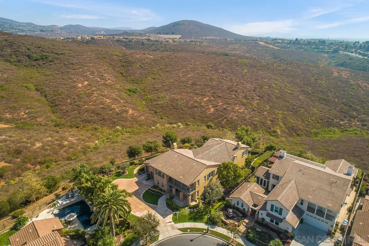 6941 Sitio Cordero Carlsbad, CA 92009 - Photo 43 of 44 an aerial view of houses with a lake