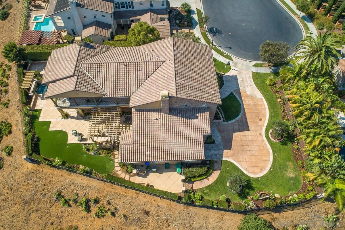 6941 Sitio Cordero Carlsbad, CA 92009 - Photo 44 of 44 an aerial view of a house with swimming pool and large trees