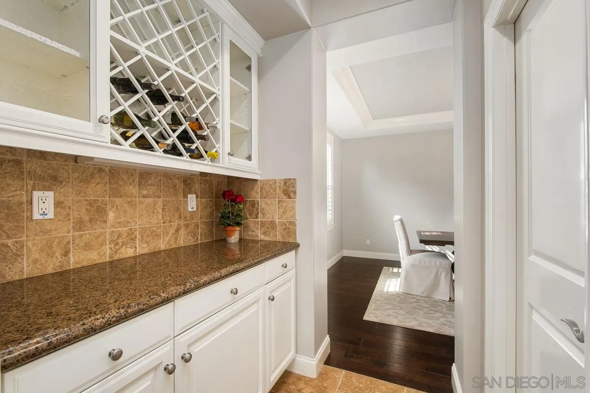 6941 Sitio Cordero Carlsbad, CA 92009 - Photo 10 of 44 a bathroom with a sink and a mirror