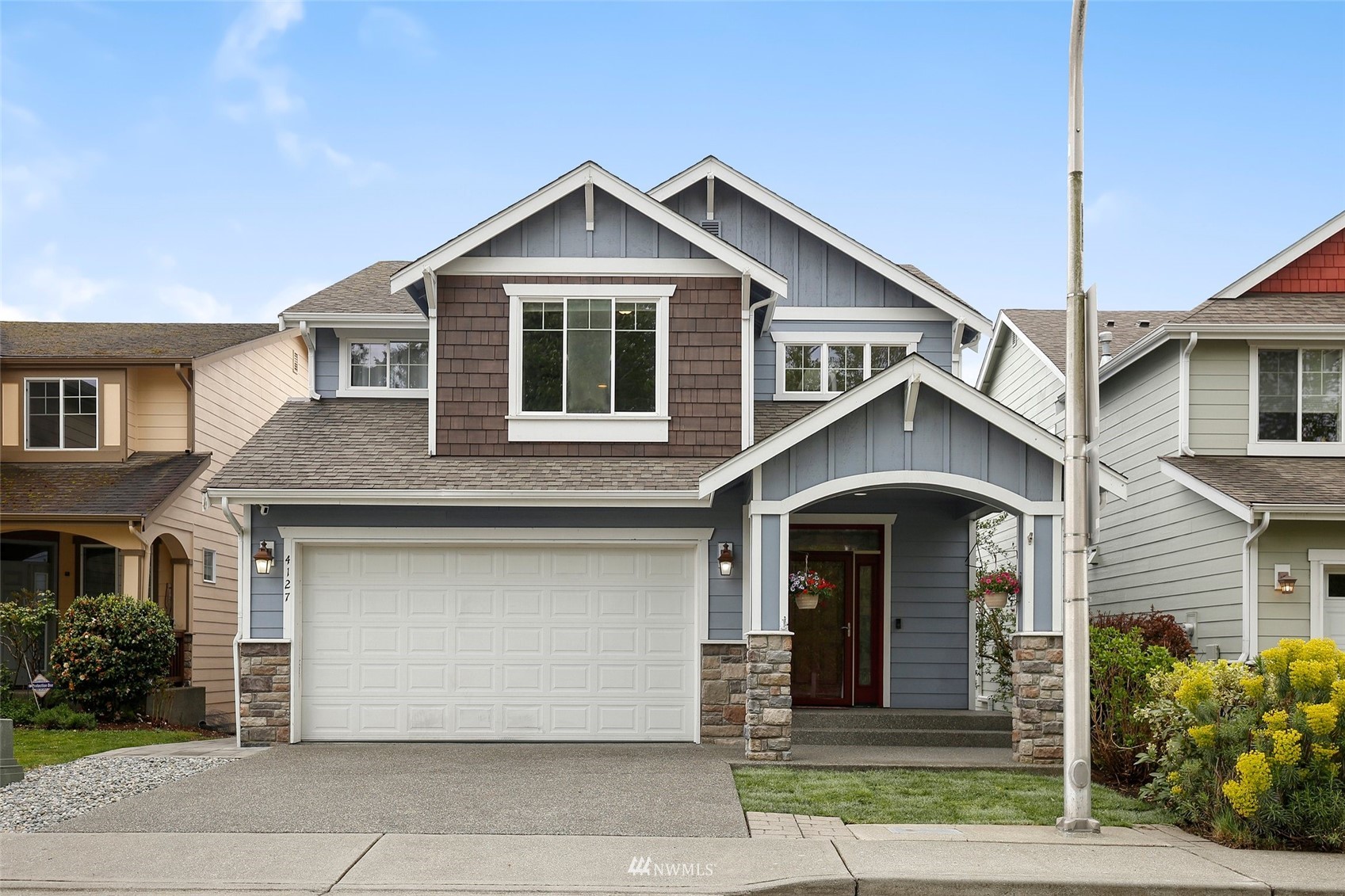 4127 Northeast 5th Court Renton, WA 98059 - Photo 1 of 36 a front view of a house with yard