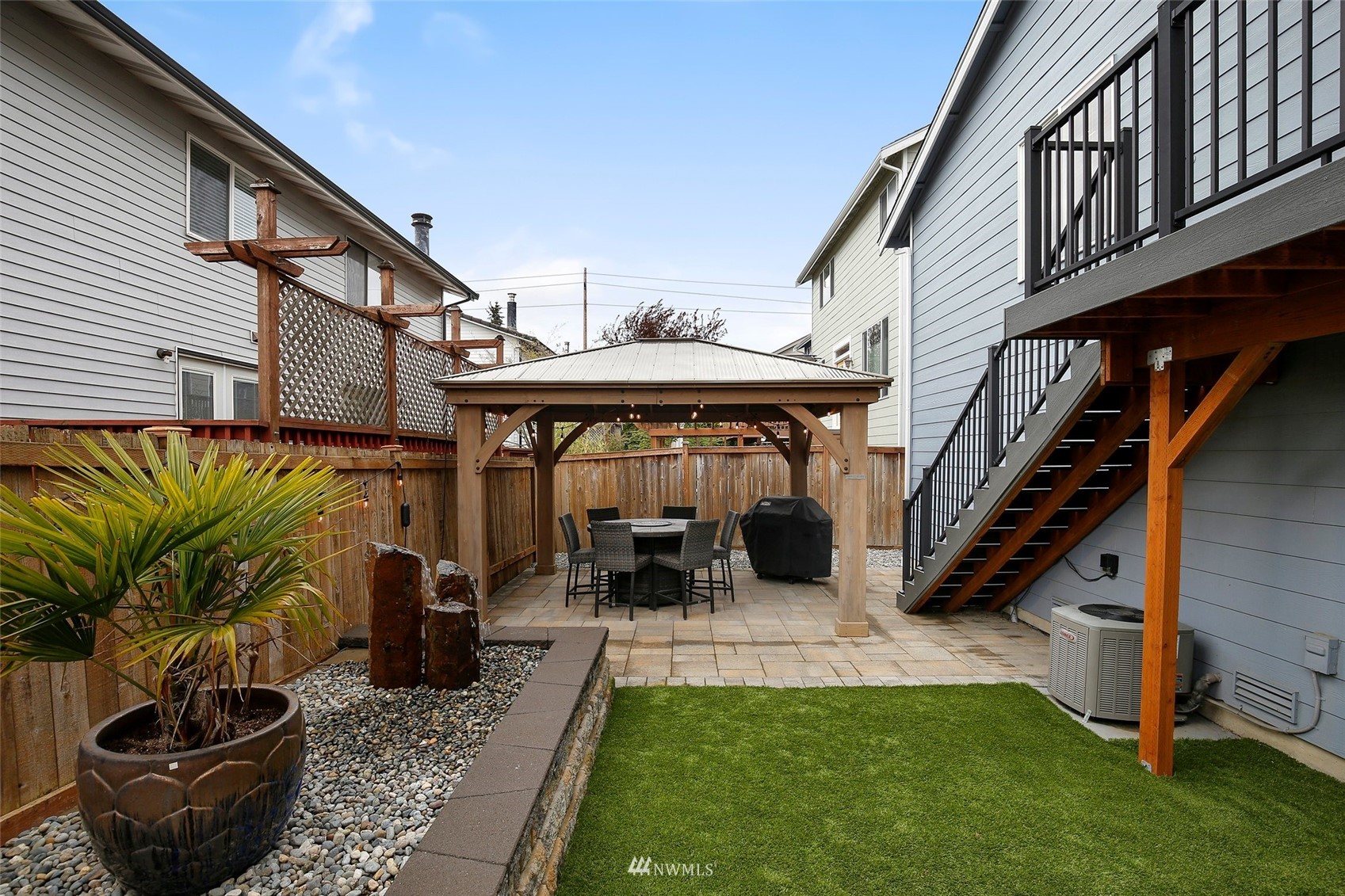 4127 Northeast 5th Court Renton, WA 98059 - Photo 11 of 36 a view of a house with backyard sitting area and furniture
